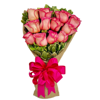Bouquet of pink roses wrapped in burlap with a bright pink ribbon