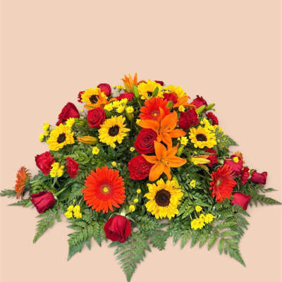 Bright mixed bouquet with red roses, orange lilies, and yellow daisies