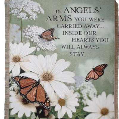 Memorial blanket with white daisies, butterflies, and a sympathy message