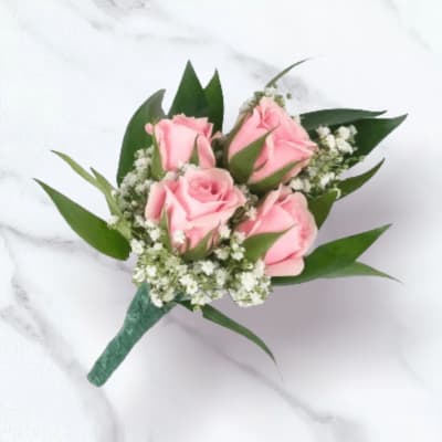 Small bouquet of pink roses with white filler flowers