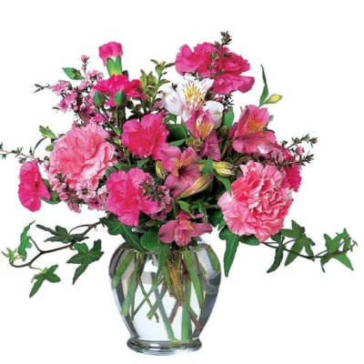 Pink mixed flower arrangement in a clear glass vase