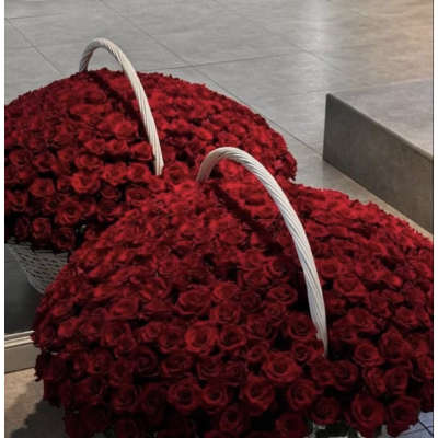 Two large baskets filled with red roses