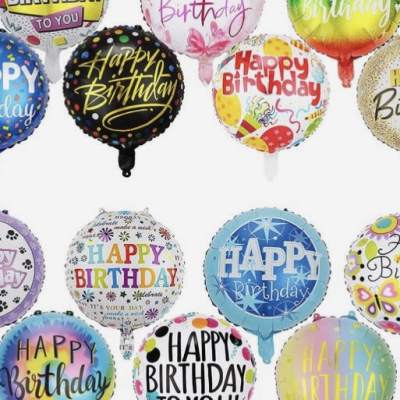 Assorted round birthday balloons with colorful "Happy Birthday" text
