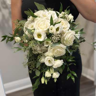 White rose and lisianthus bouquet with greenery