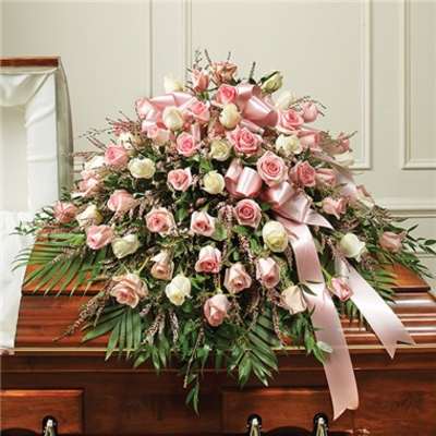 Pink and white rose casket spray with satin ribbon