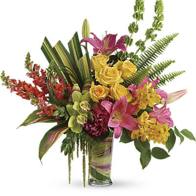 Tall arrangement with pink lilies, yellow roses, and orchids in a clear glass vase