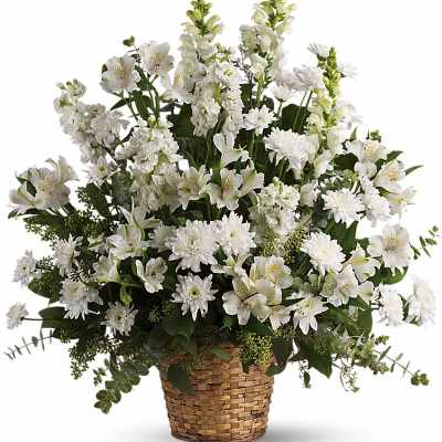 Tall all-white flower basket with alstroemeria, mums, and snapdragons in a woven container
