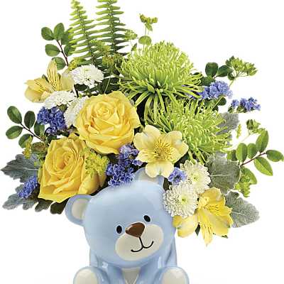 Cheerful yellow and green flower arrangement in a light blue ceramic bear container