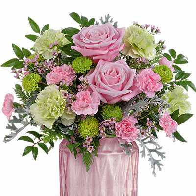 Pink and green mixed flower arrangement with roses and carnations in a pink glass vase