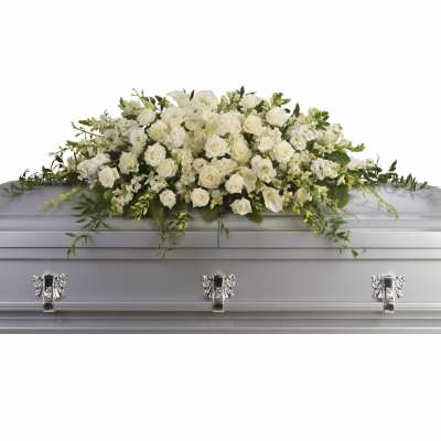 Long white rose and calla lily casket spray on a silver casket