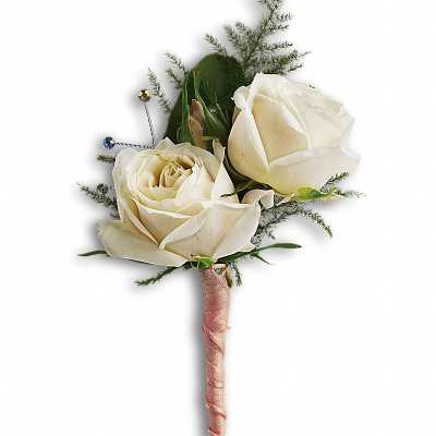 Ivory rose boutonniere with airy accents and pink ribbon-wrapped stem.