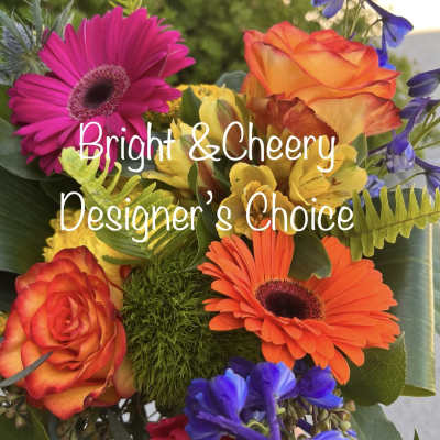 Bright mixed bouquet with gerbera daisies, roses, and blue flowers