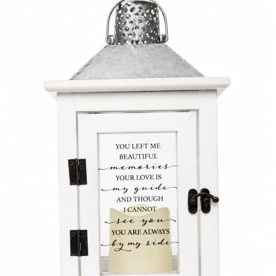 White memorial lantern with a printed sympathy message