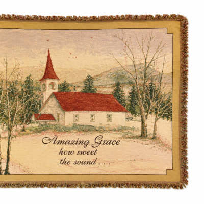 Fringed wall hanging with a church scene and the words Amazing Grace