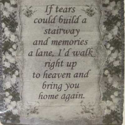 Decorative memorial sign with floral border and a sympathy quote