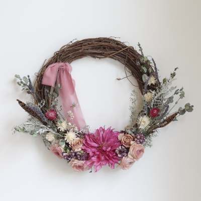 Floral wreath with pink ribbon and mixed pink and white flowers