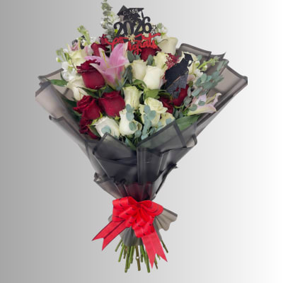 Bouquet of red and white roses with lilies, wrapped in black paper and tied with a red ribbon