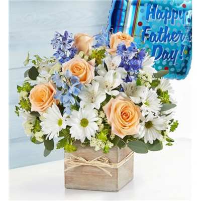 Peach roses and white daisies in a wooden box with a Father's Day balloon.