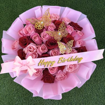 Pink and red rose bouquet with a Happy Birthday ribbon