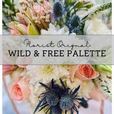 Pastel bouquet with pink roses, white blooms, and blue thistle-like flowers
