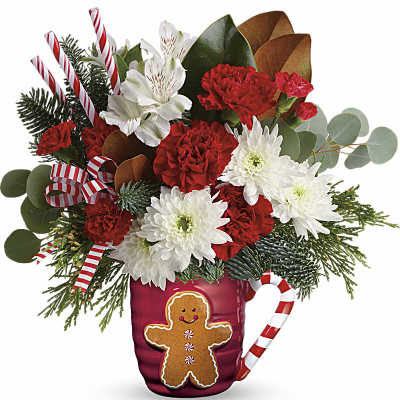 Christmas bouquet in a red mug with candy cane accents and a gingerbread decoration