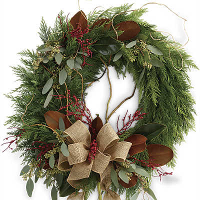 Holiday wreath with evergreen foliage, red berries, and a burlap bow
