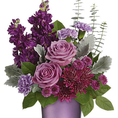 Pink and purple flower arrangement in a lavender vase