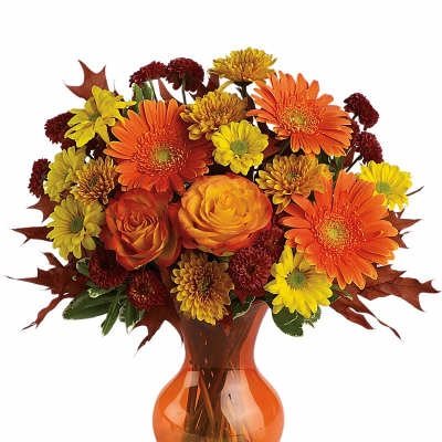 Orange and yellow mixed flower bouquet in an amber glass vase