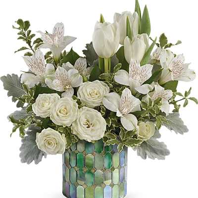 White tulips and roses in a mosaic glass vase