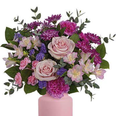 Pink and purple mixed flower bouquet in a pink vase