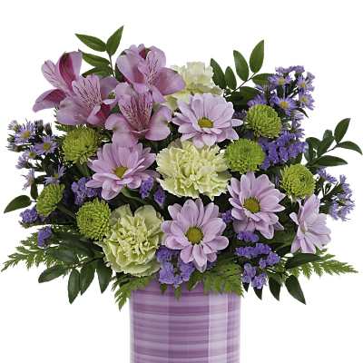 Pink and purple mixed bouquet in a lavender vase
