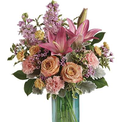 Pink lilies and peach roses in a blue glass vase