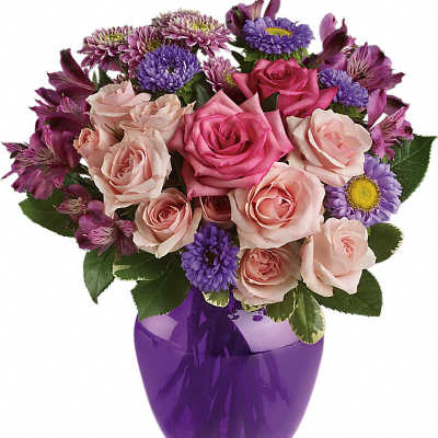 Pink roses and purple daisies in a purple glass vase