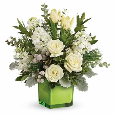 White roses and tulips arranged in a green glass vase