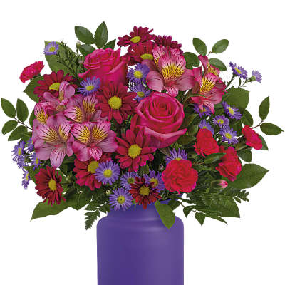 Mixed pink and purple bouquet in a purple vase