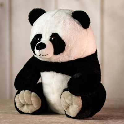 Black and white plush panda bear sitting upright