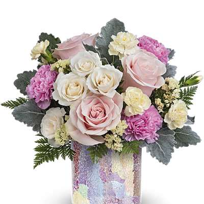 Pink and white roses with carnations in a mosaic glass vase