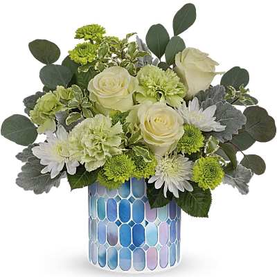 White roses and green chrysanthemums in a blue mosaic vase
