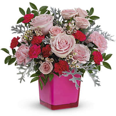 Pink roses and carnations in a bright pink vase