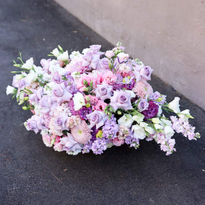 Large pastel bouquet of lavender, pink, and white flowers
