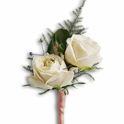 White rose boutonniere with pink-wrapped stem