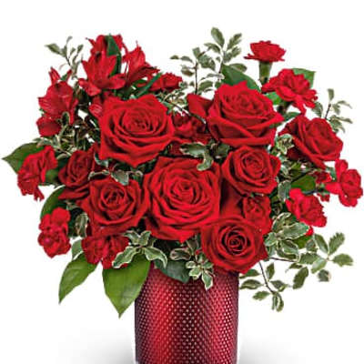 Red roses arranged in a red vase