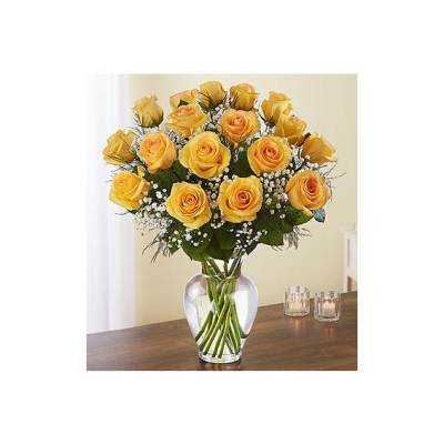 Yellow roses arranged in a clear glass vase