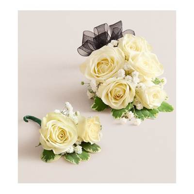 Cream rose corsage and boutonniere with black ribbon accents