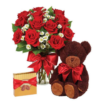 Red rose bouquet with a teddy bear and a gift box