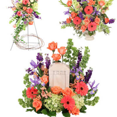 Floral arrangement with orange roses, pink gerbera daisies, and purple blooms