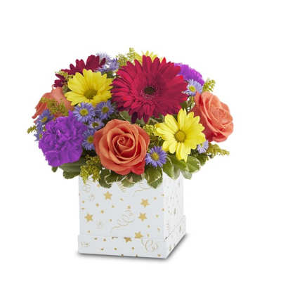 Colorful bouquet of daisies and roses in a decorated white box