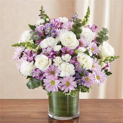 Pink and white mixed bouquet in a glass vase