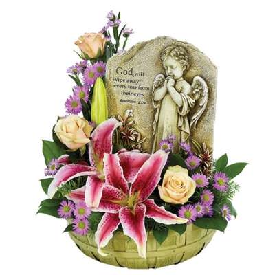 Basket arrangement with pink lilies, pale roses, and a memorial angel plaque
