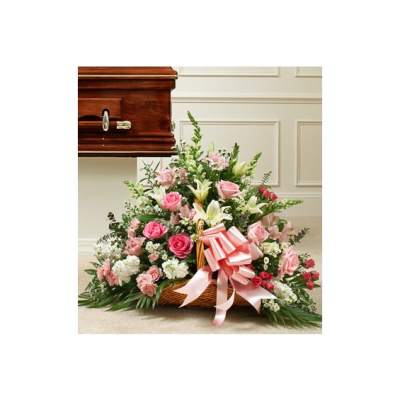 Pink and white floral casket spray with a ribbon bow
